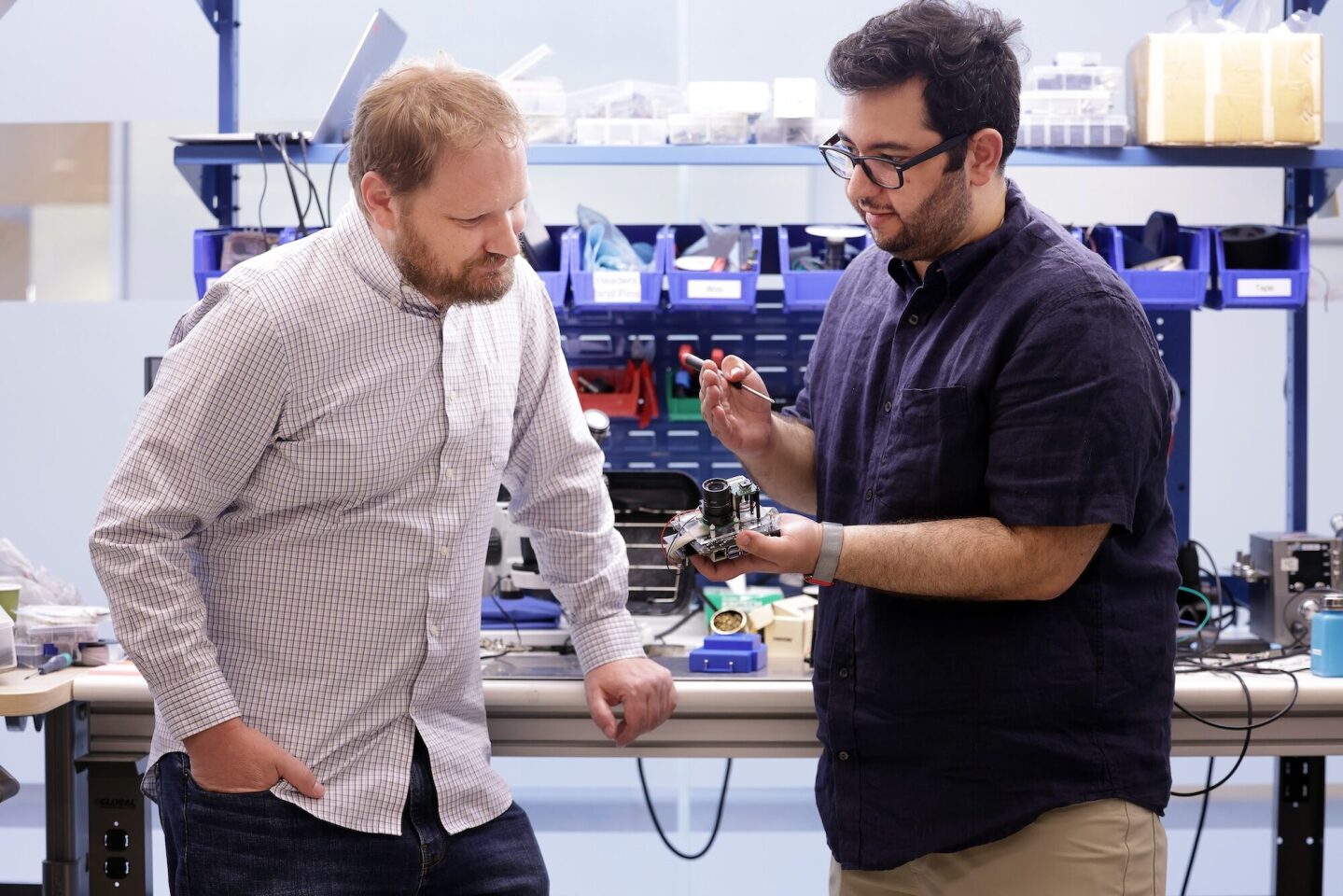 Alanson Sample, an associate professor of computer science and engineering, and Yasha Iravantchi, a doctoral student in computer science and engineering, prepare PrivacyLens for a demonstration