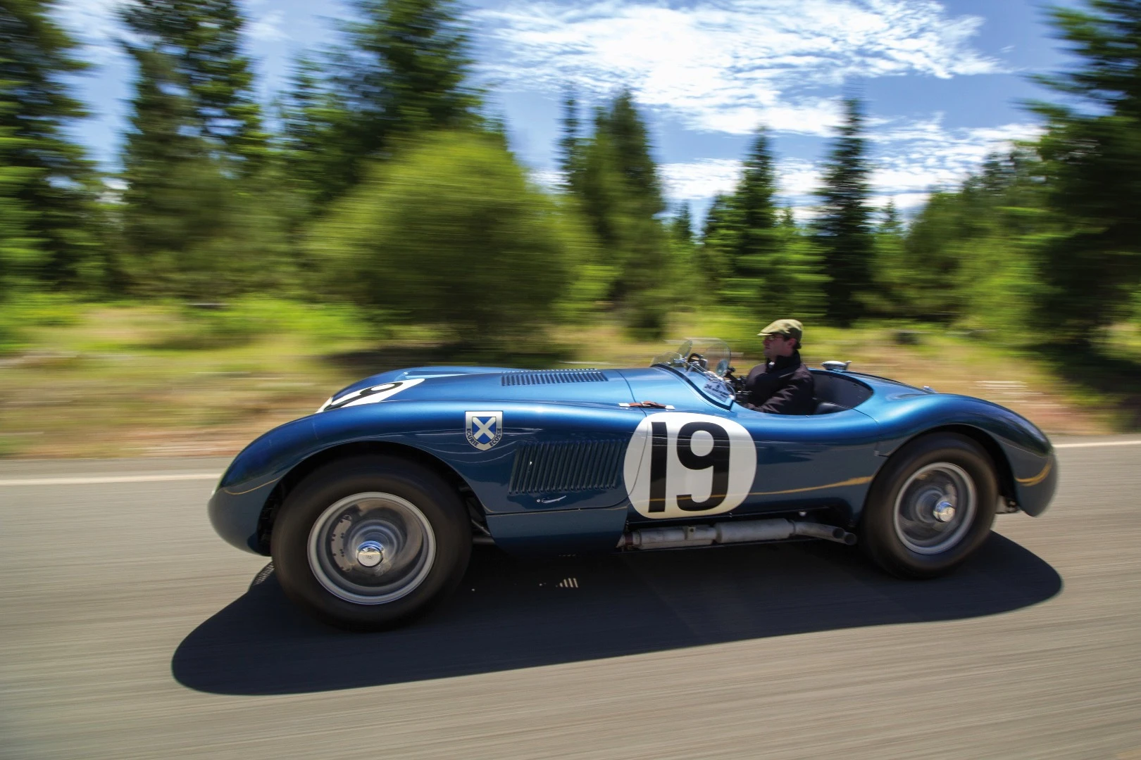 There were just 53 C-Type Jaguars built. Three lightweight works cars (of which this car is one), and a run of 50 cars to satisfy customer demand after the factory cars finished first, second and fourth in the 1953 Le Mans 24 Hour event. The biggest difference to the competition were the disc brakes. Endurance racing was born to demonstrate reliability and validate new automotive technologies for the masses and just as it has done more recently with hybrid and diesel drivetrains, Le Mans heralded the coming of age of a new braking technology with this car and its works siblings. The winning C-type was the first to average more than 100 mph for the 24 Hours of Le Mans (105.8 mph, 170 km/h), and this car, which finished fourth, also broke the ton, averaging 104 mph (167 km/h). Equally at home in any of the world’s finest concours or vintage rallies, this car represents a landmark in Jaguar history.