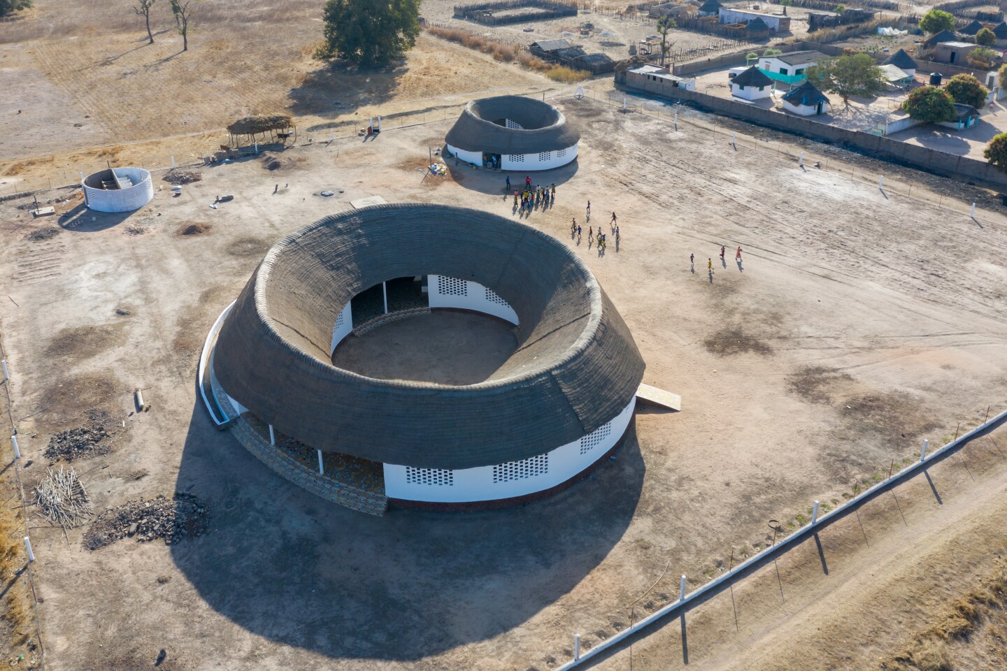 Fass School and Teachers' Residences was made using local sustainable materials like mud bricks, thatch, and bamboo
