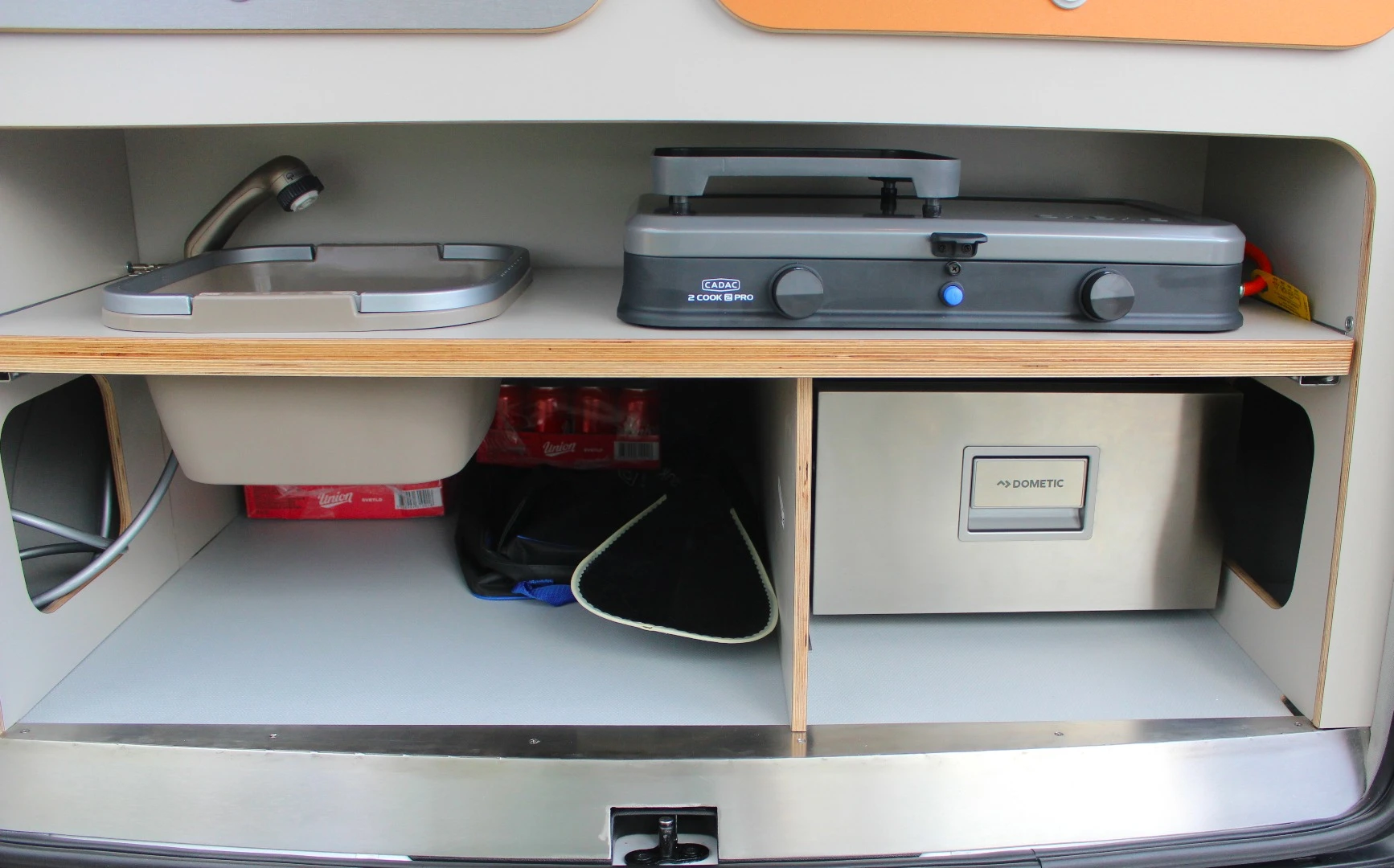 The kitchen area stores away quickly and neatly