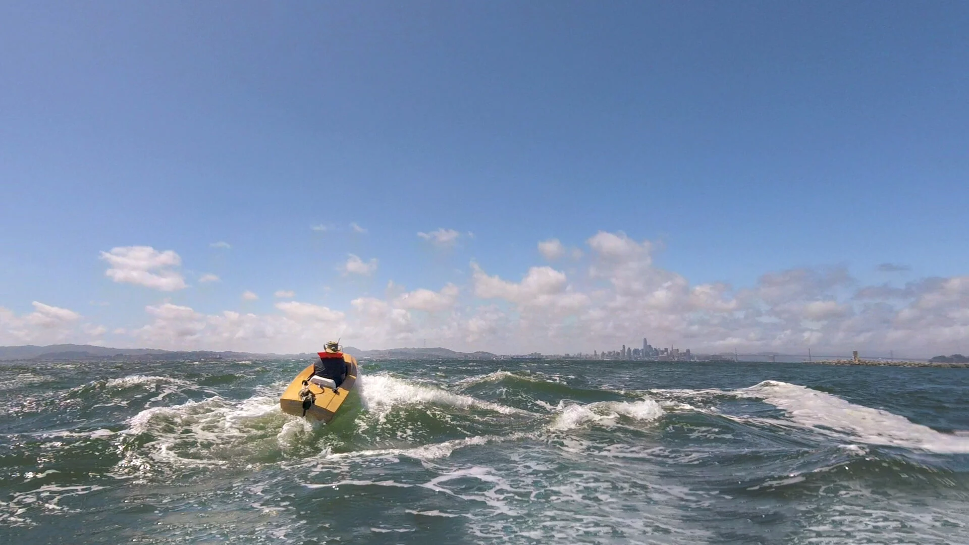The Mini Boat tackling the big waves out at sea