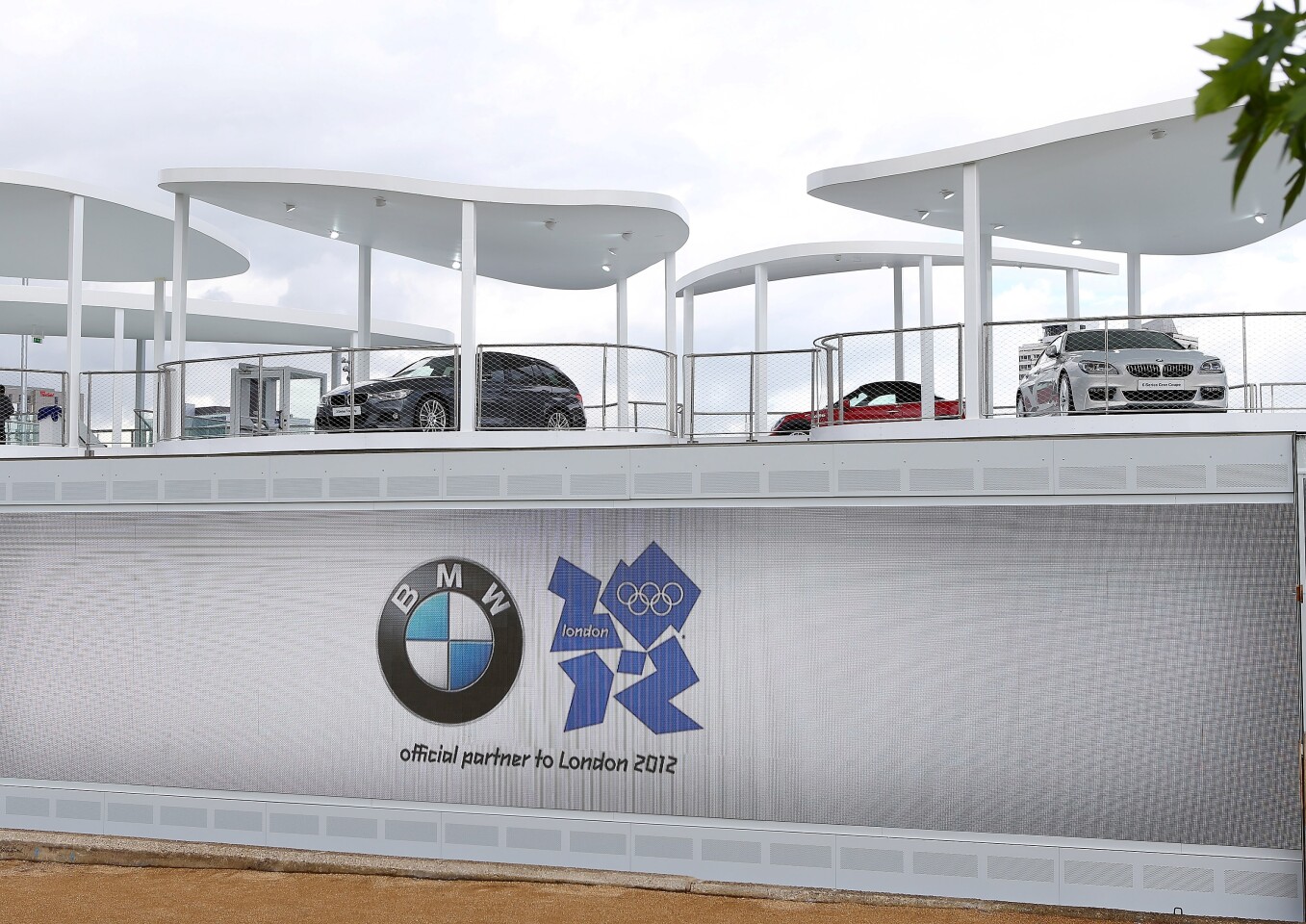 The upper floor includes nine individual pavilions highlighting BMW models