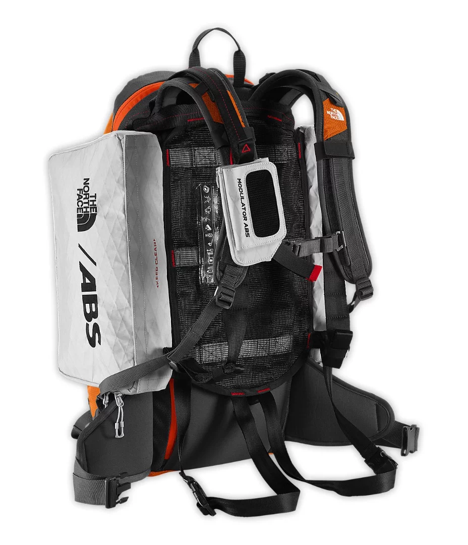 The airbag compartments secure to the pack sides, while the trigger mechanism mounts around the strap