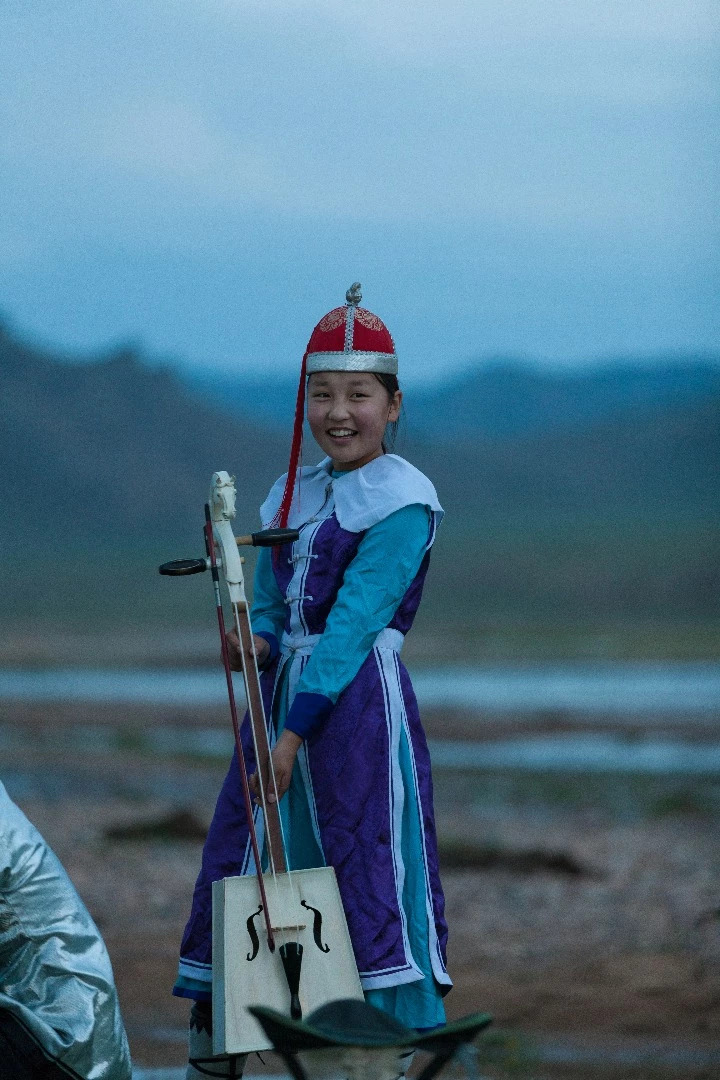 Young performer on the banks of the river outside Uliastai