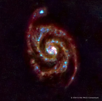 Composite PACS image of spiral galaxy M51 (Image: ESA and the PACS consortium)