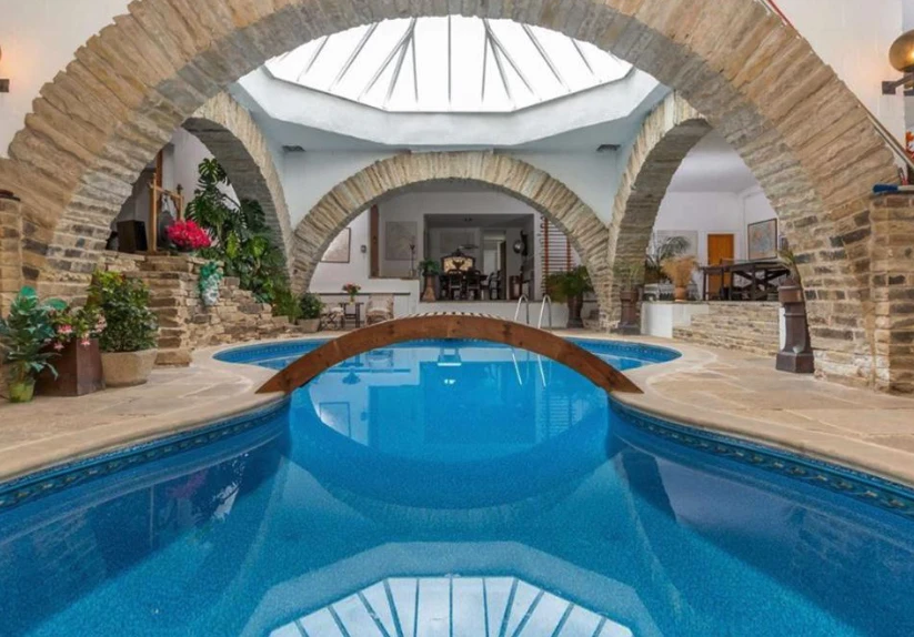 Underhill is arranged around a family recreation area with large stone arches and a heated indoor swimming pool