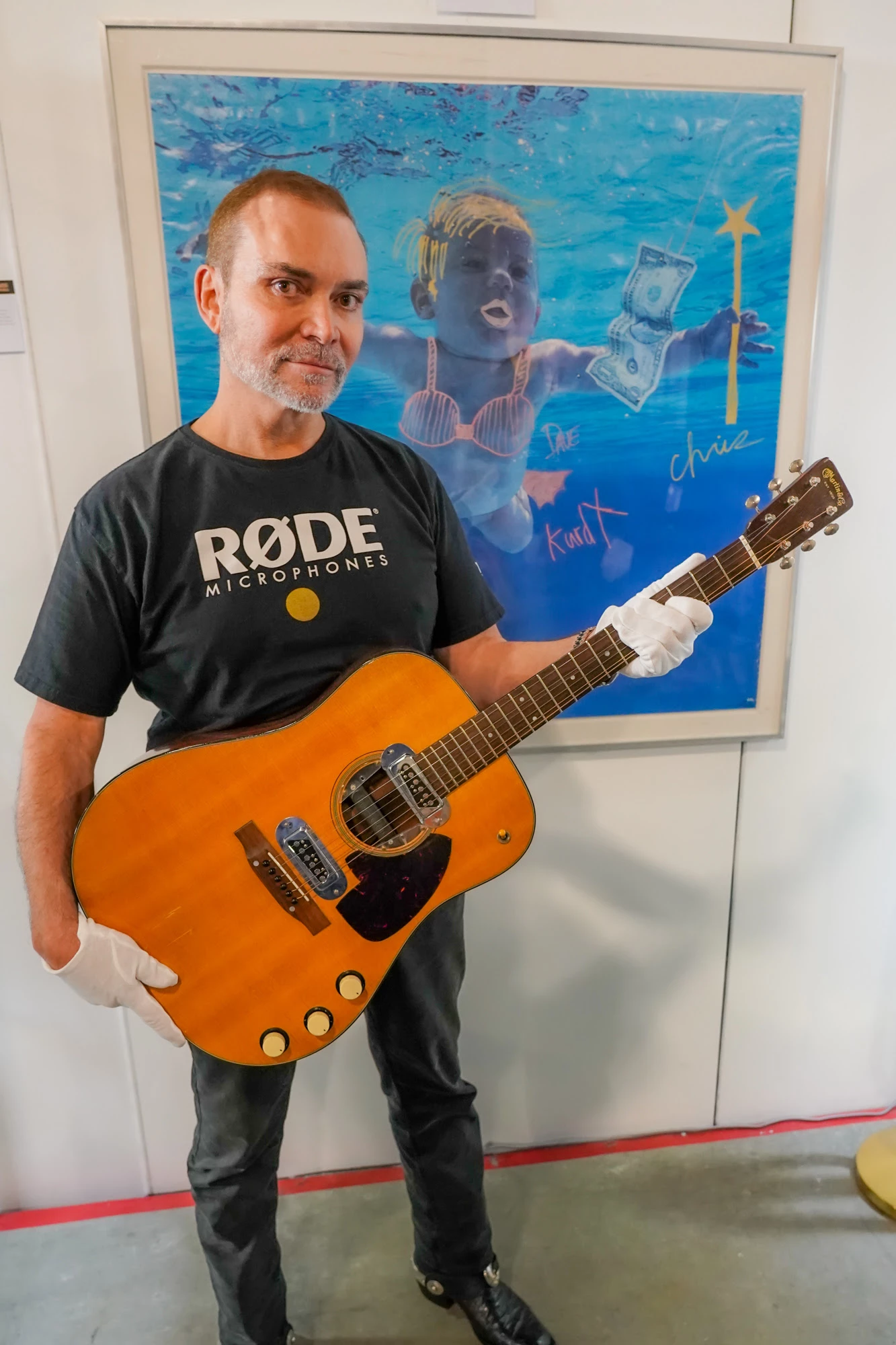 Peter Freedman with his newly acquired Cobain's Martin D-18E. Freedman plans to use the guitar as a vehicle to spotlight the struggles faced by those in the performing arts.