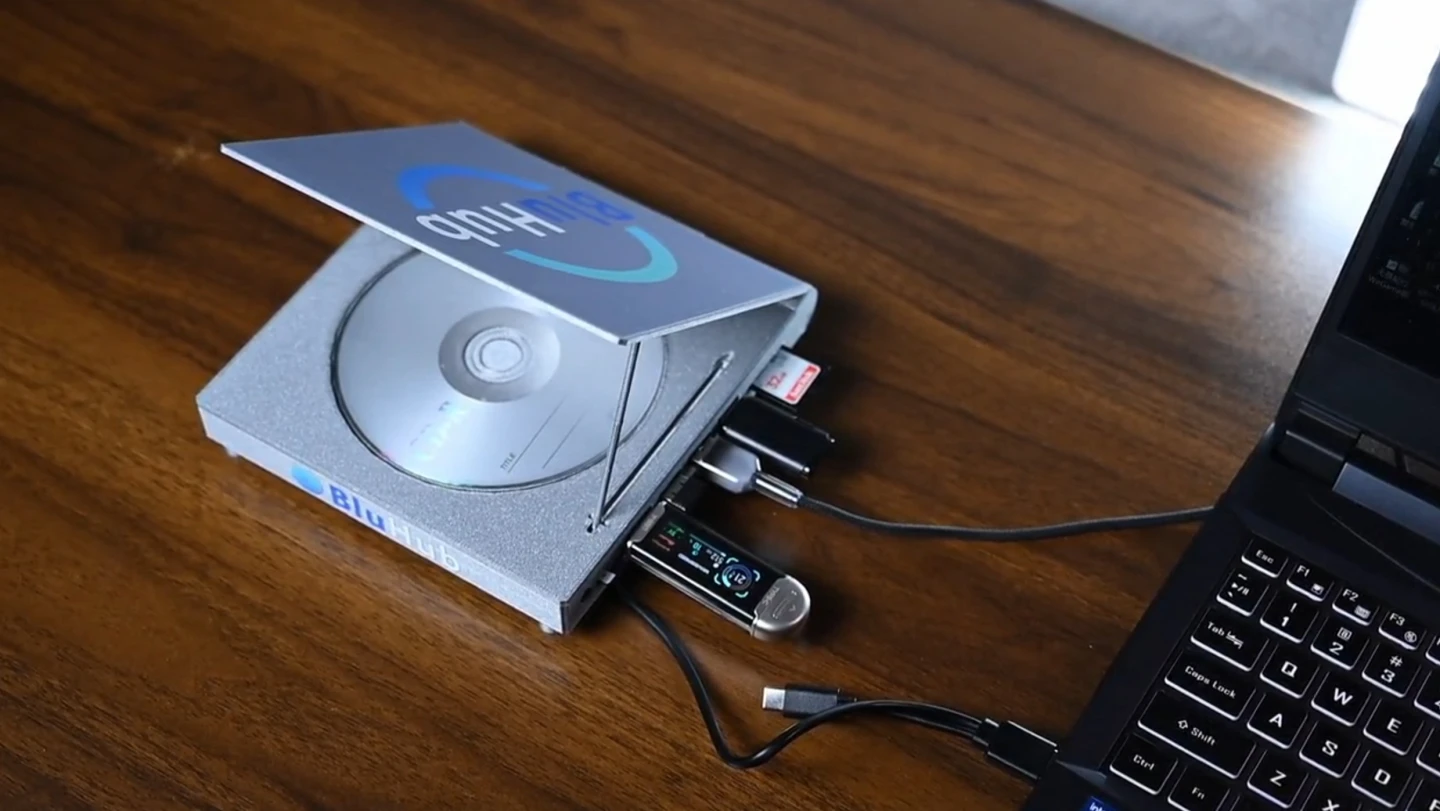 The BluHub can read/write a disc in the tray while keeping a spare under the 'piano' lid, and hosts USB ports and media card readers for flexible connectivity