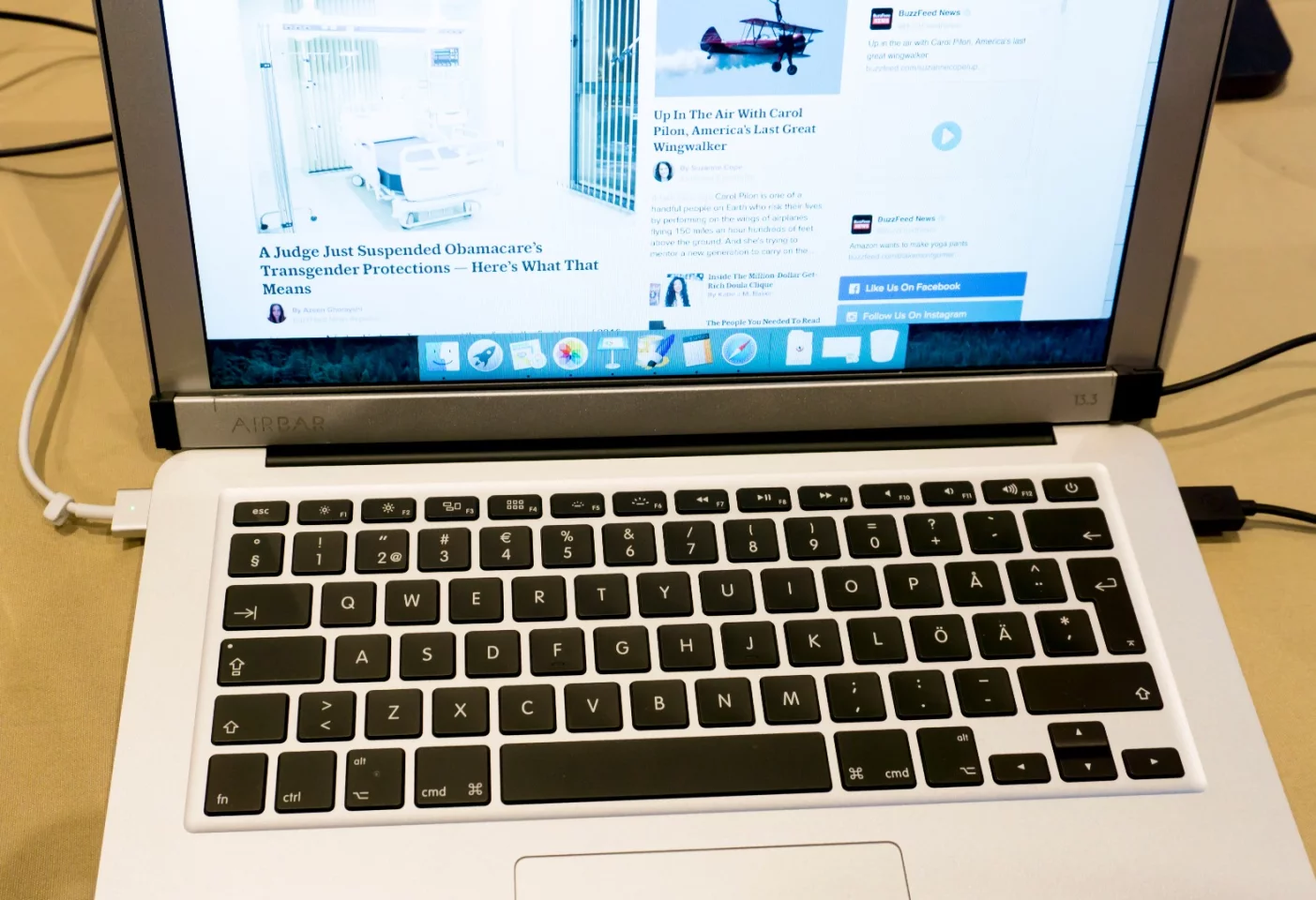 The Touch Bar sits below the MacBook Air's screen