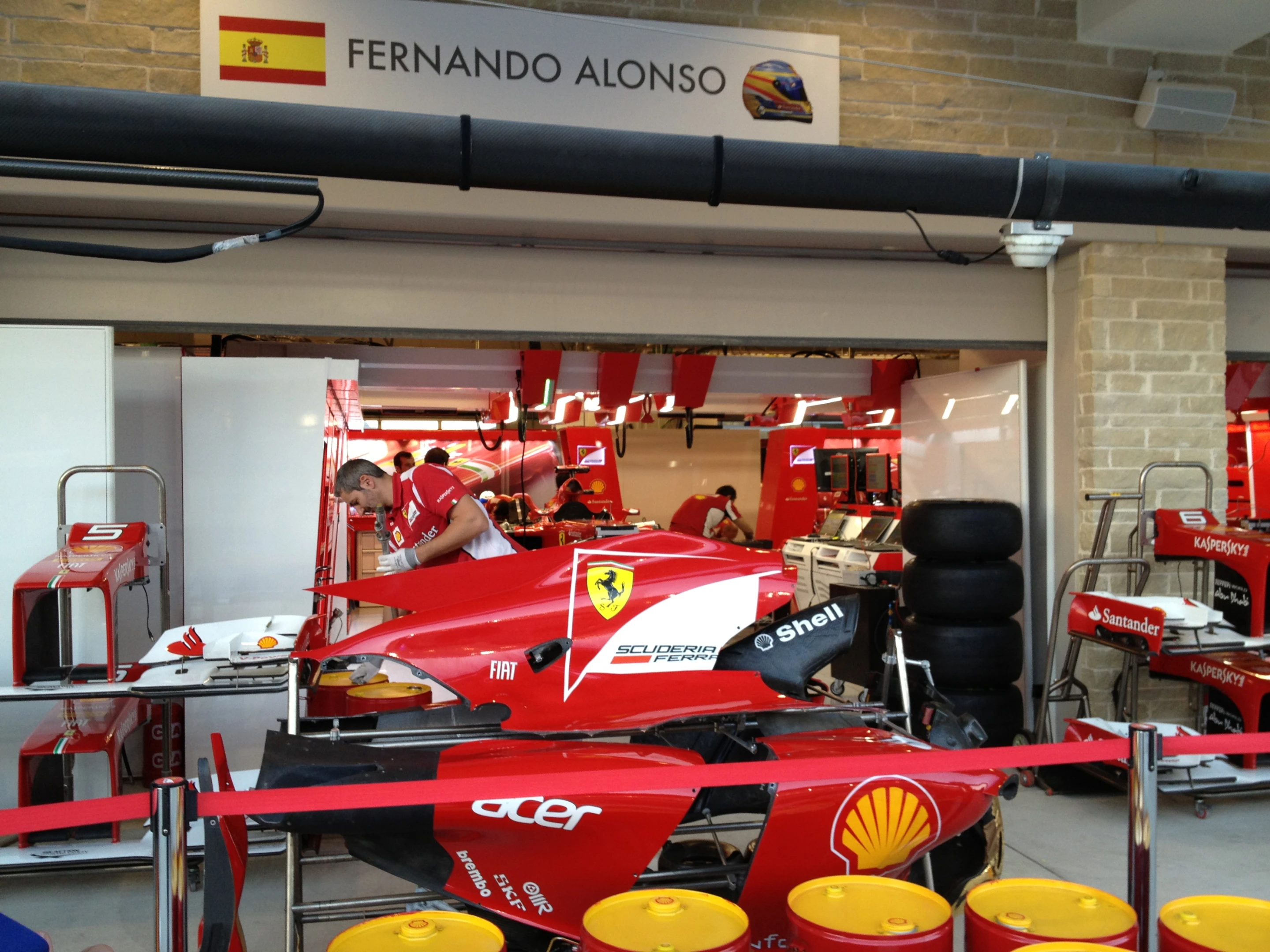 Fan favorite Ferrari Racing has always featured bright red cars. Here the crew works on the car of Fernando Alonzo between races