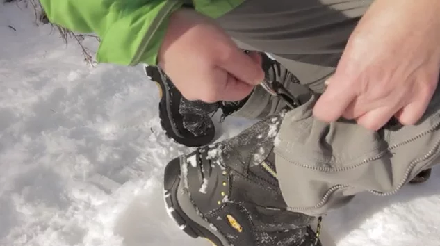 The cables strap to the tabs commonly found on the backs of shoes and boots