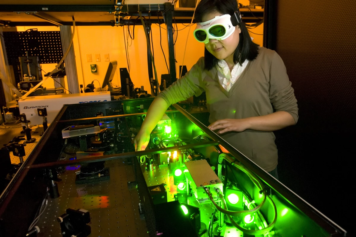 Purdue mechanical engineering student Yaguo Wang works with a high-speed laser at the Birck Nanotechnology Center to study thermoelectric generators (Photo: Purdue/Mark Simons)