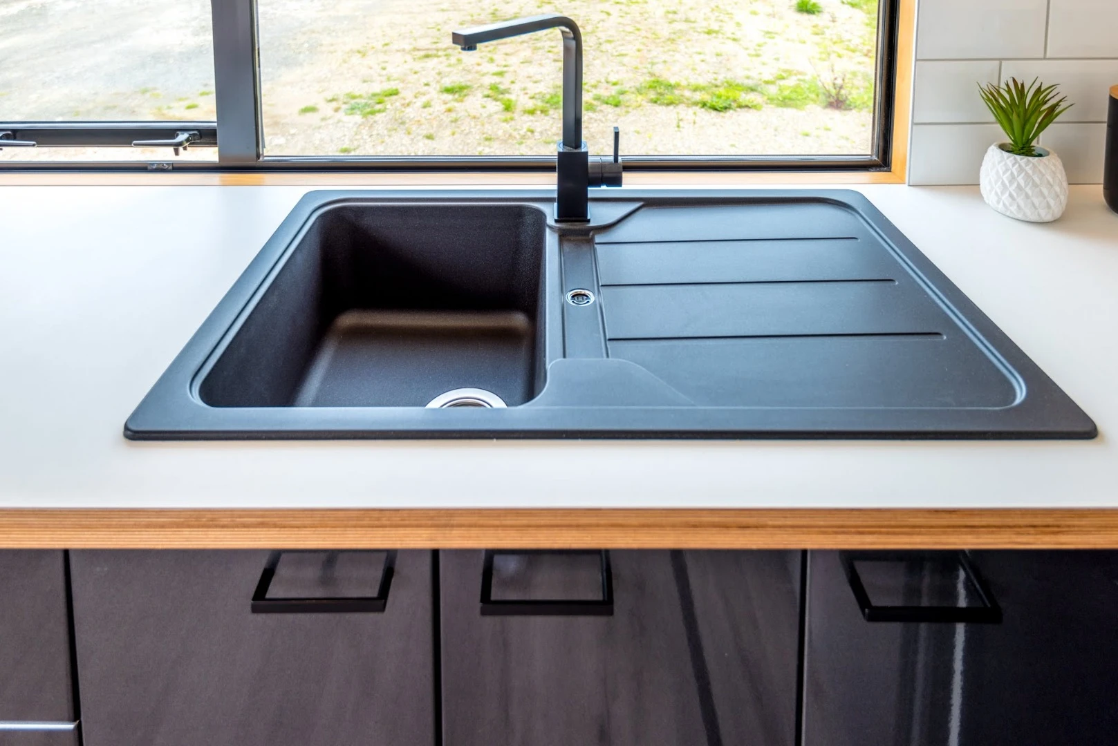 Gorgeous kitchen sink of the Pohutukawa home