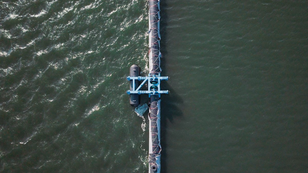 This aerial shot shows how the Ocean Cleanup System absorbs impact from surface waves