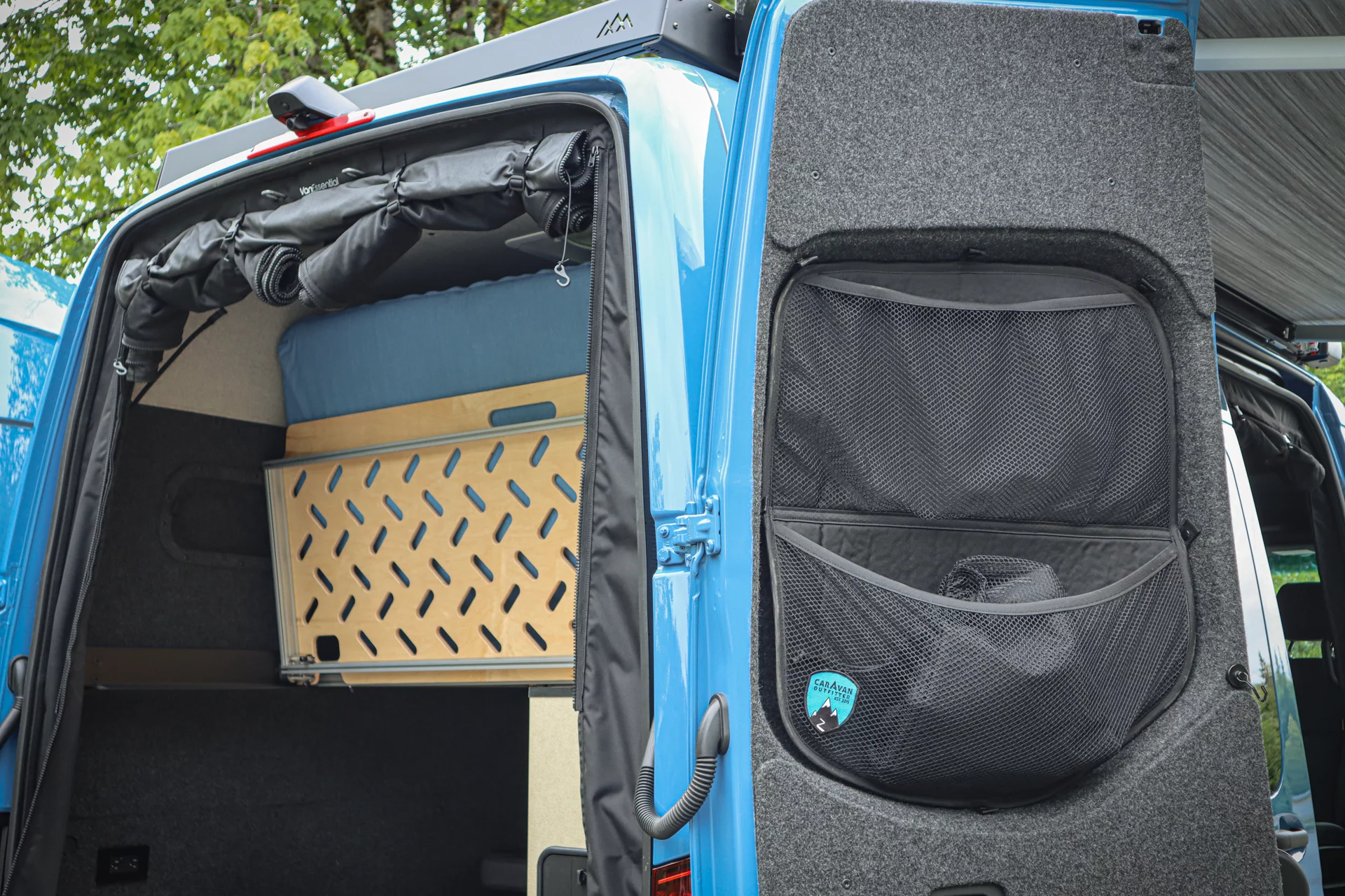Rear door storage pockets can be accessed from the bed or outside the van