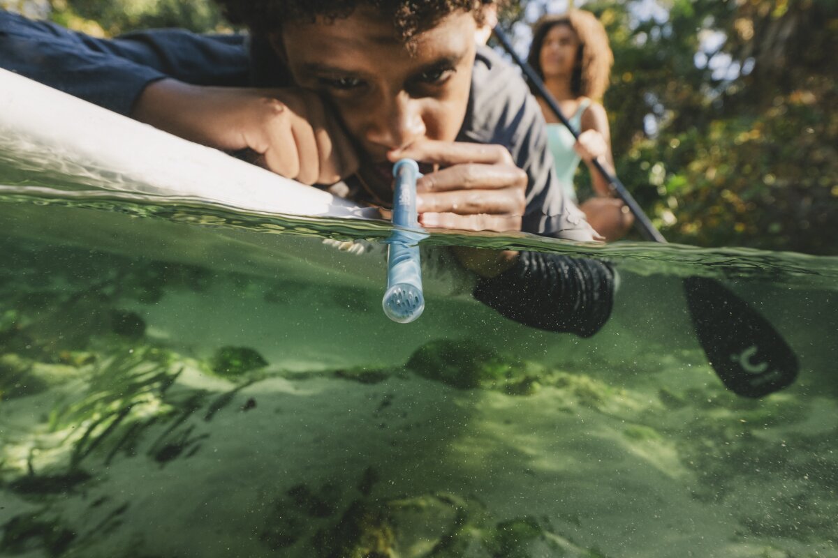 Sleek survival straw weighs less than 1 oz, filters water every sip