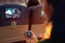 Bluetooth retransmitters are starting to be built into wireless earbuds charging cases, so you can use them with in-flight movies