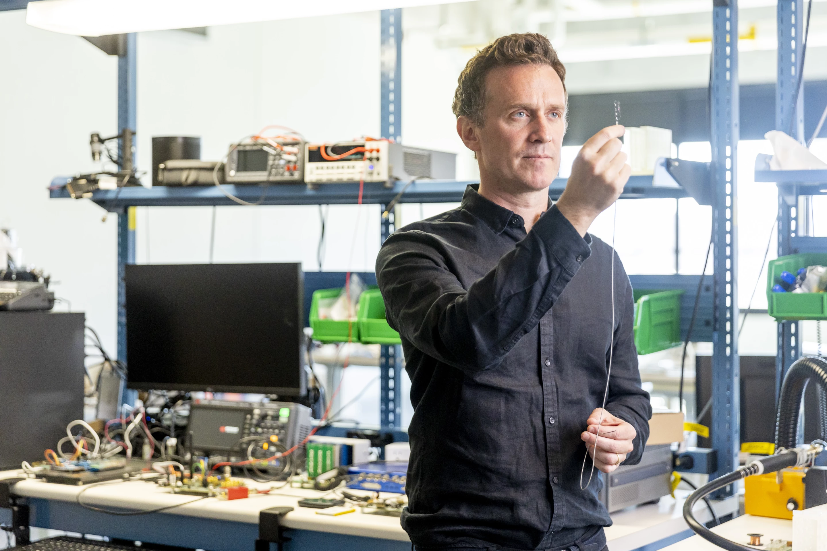 Synchron's Thomas Oxley holds up a Stentrode