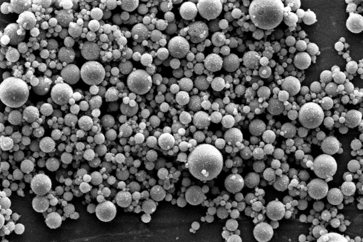A scanning electron microscope image of fly ash particles, which have been used to make an environmentally friendly binder for concrete production that requires no cement
