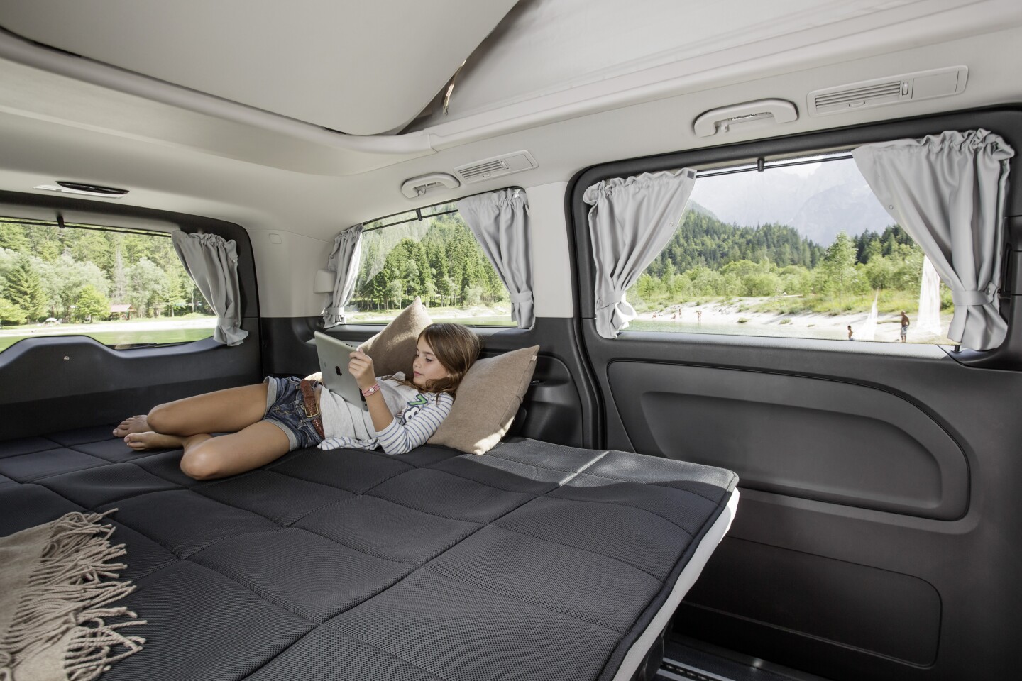 The three-seat rear bench folds down into a bed for up to three