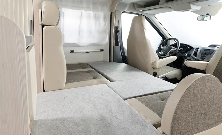 The convertible front single bed uses the dinette bench and opposing seat for support