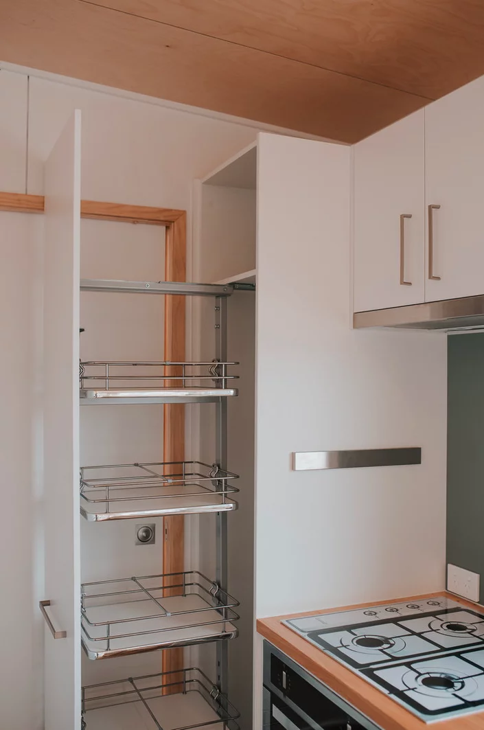 The Kōtuku's kitchen includes a large pull-out pantry drawer
