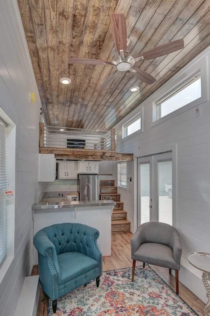 The high ceiling throughout the Journey tiny house gives this luxurious pint-sized dwelling a relatively spacious interior