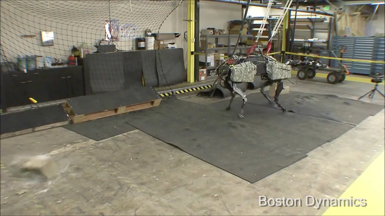 The cinder block lands several feet away from the robot's position