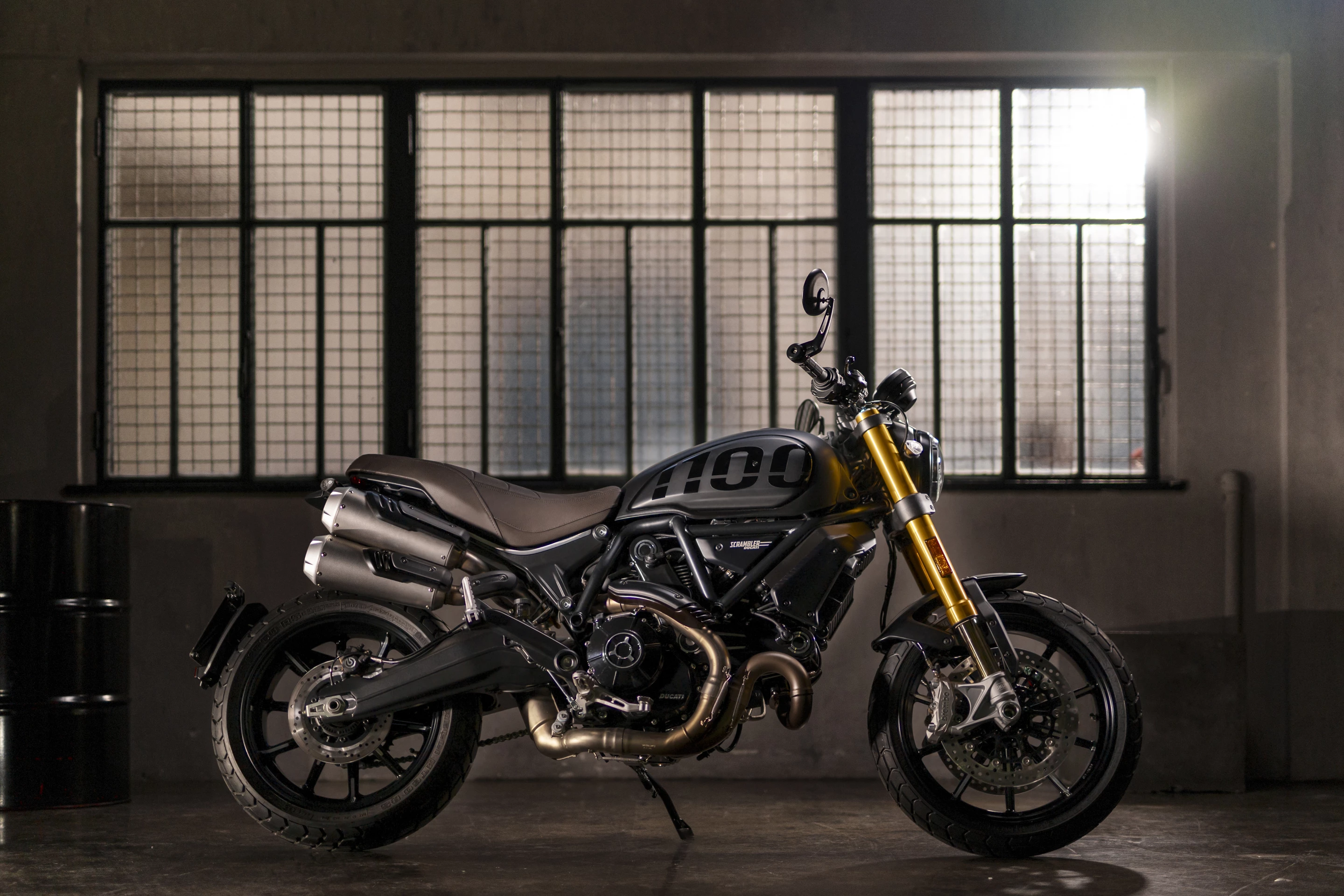 Bar-end mirrors and Ohlins gold suspension denote the Sport Pro