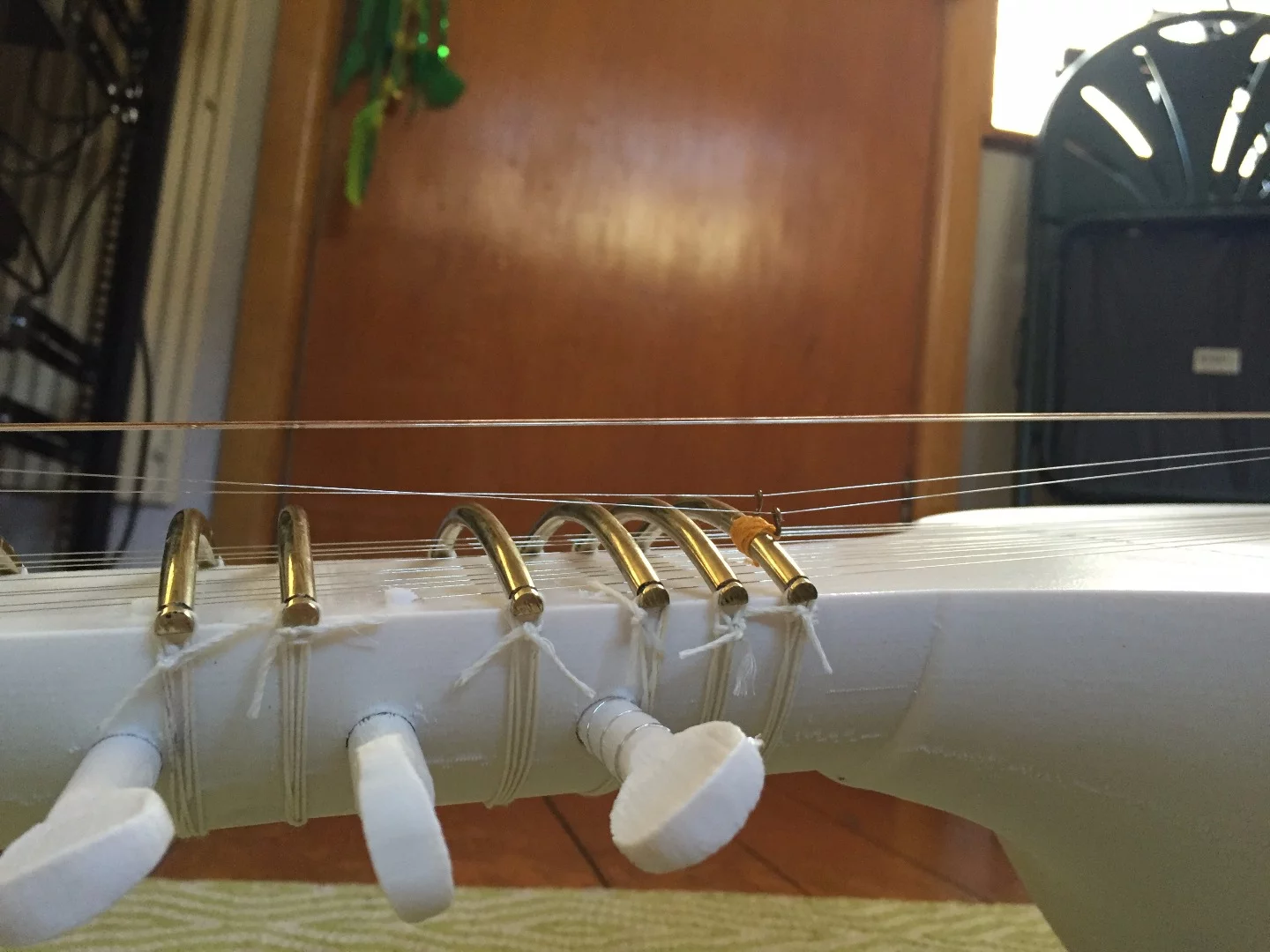 Non-printed parts include the strings, the frets and a standard bridge