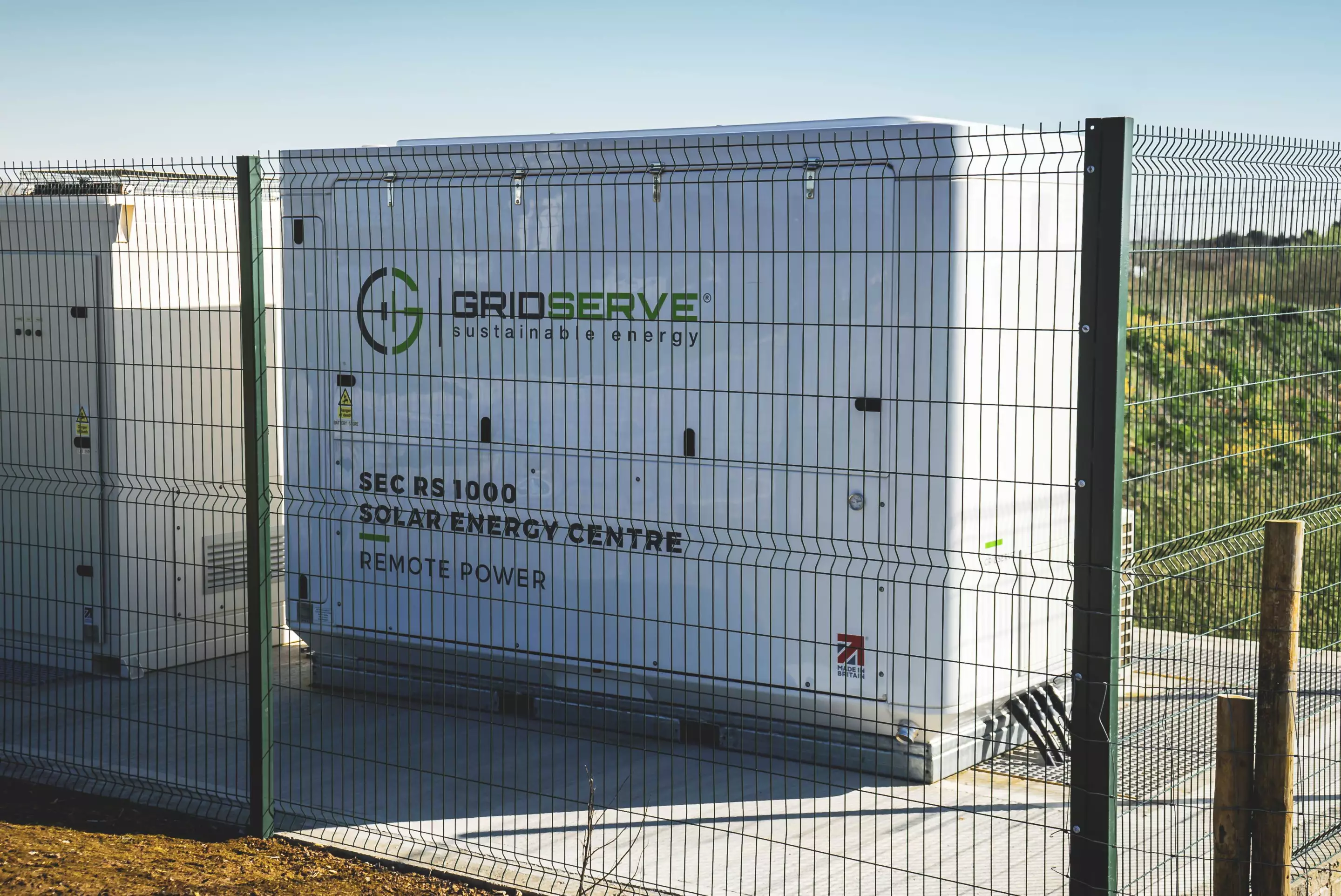 The 1-MW onsite battery draws slowly from the grid, and discharges quickly when needed. The solar canopy above the charging bays also help ease the load, but GridServe is hoping to build a huge solar farm next to Cornwall Services