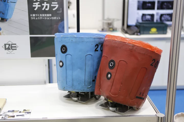 A couple of social trash box robots, on display in Tokyo at IREX 2013