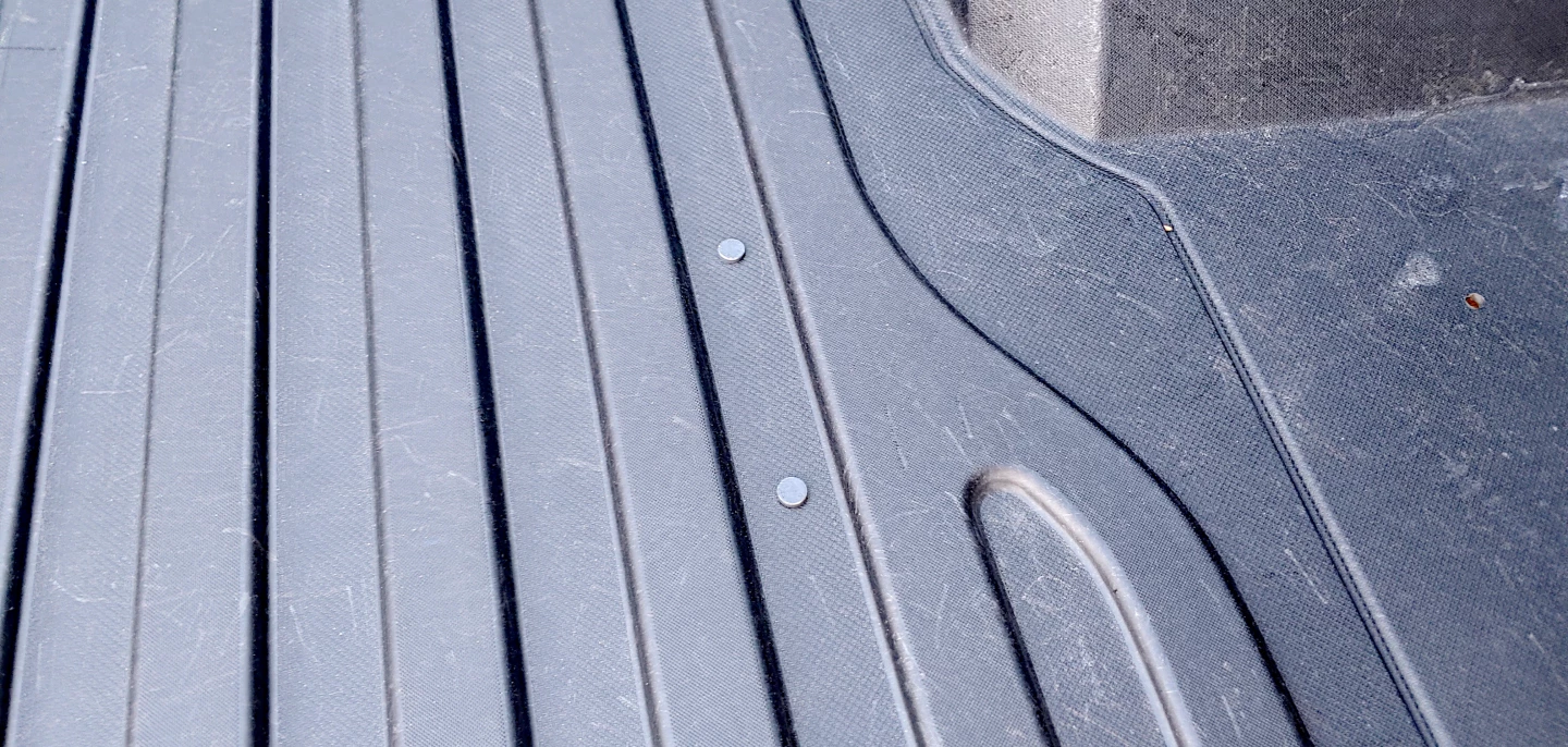 The corrugations pressed into the GMC CarbonPro bed give the non-slip benefits of a spray-in liner without the added weight