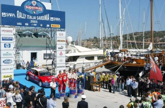 The beautiful setting of the Sardinia Yacht Club sees the top three pairings on the victory dias on Sunday afternoon, May 1.