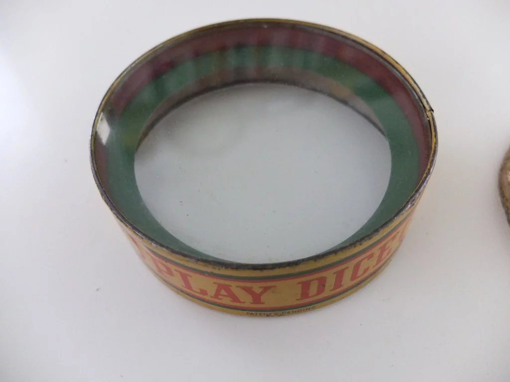 The casing of the game is modified to incorporate a motor that's used to roll the dice