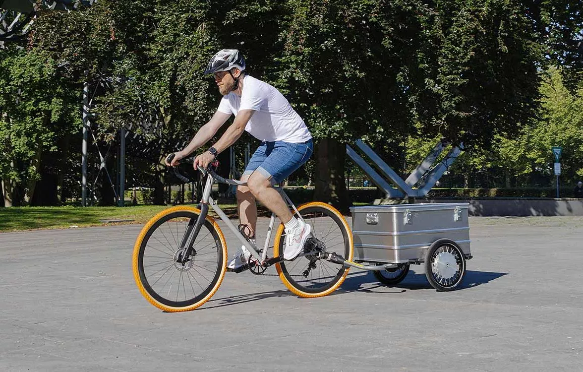 The Paxxter e trailer features two 125-W hub motors and a removable battery to help cancel out the extra load towed behind a bike