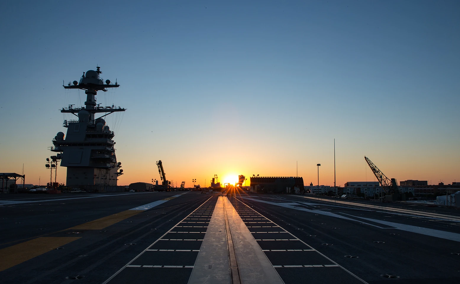 Sun rising over the flight deck of USS Gerald R Ford