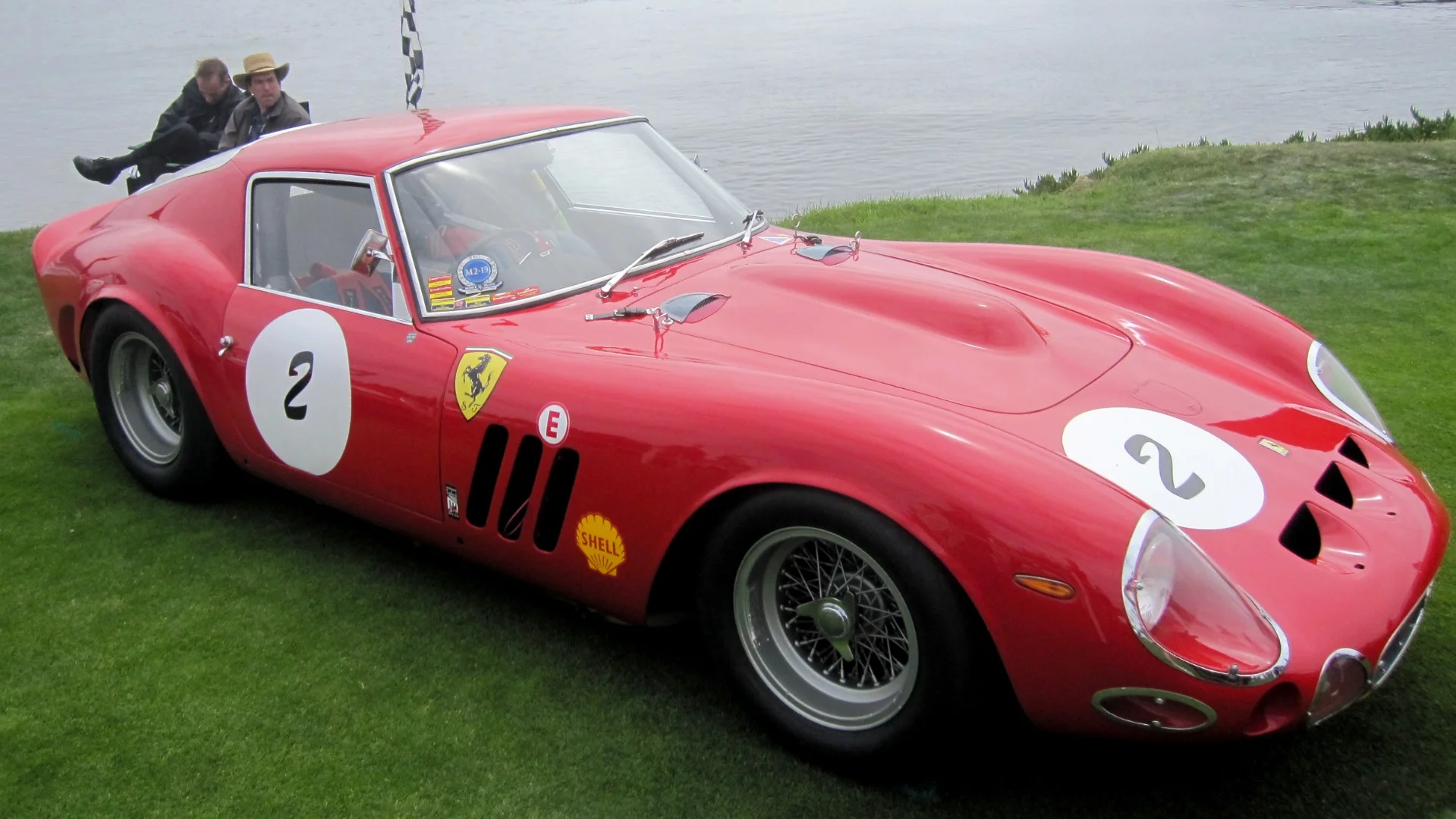 This car, Ferrari 330 GTO #4561GT, is owned by Carlo Vögele and is quite unique as it is one of just three genuine 330 GTO prototypes built, with the other two used by Scuderia Ferrari in racing, while this car was only ever intended for road use. #4561GT was built due to a personal request from French industrialist and Ferrari finacier Michel Paul-Cavalier to Enzo Ferrari, to his own specification. The original road car was built on a Tipo 539/566 chassis, but included a brake booster, covered headlights, blue interior trim, synchromesh transmission and a four liter Tipo 163/566 competition engine.