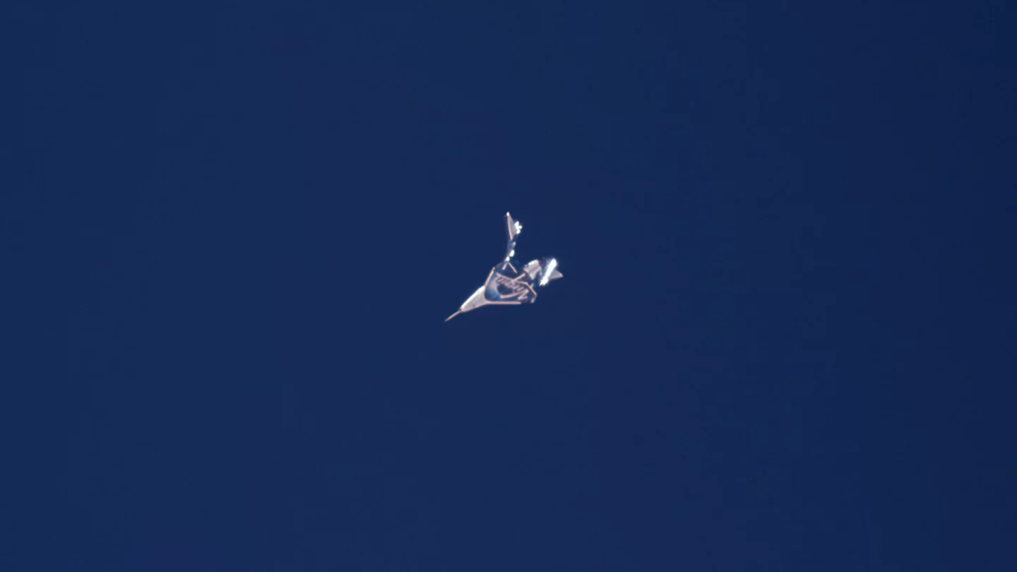 Virgin Galactic's spaceplane with its tail booms deployed