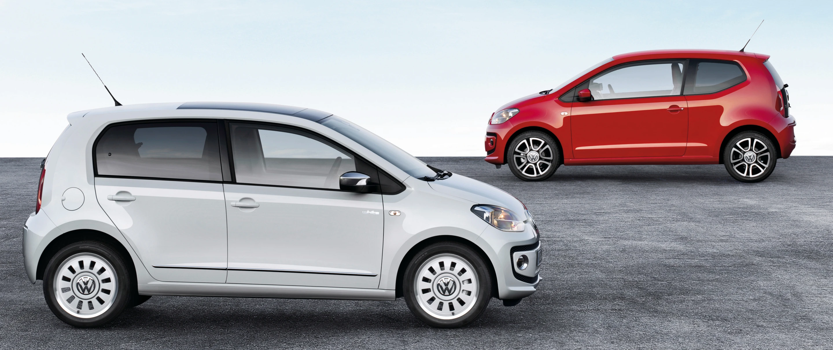 The new five-door up! (front) and the two-door model