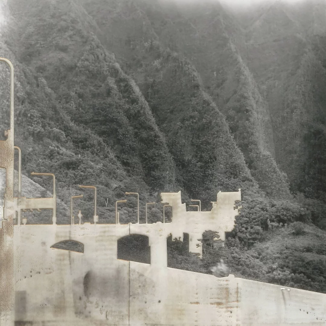 In the artist's words: "This series takes place in my home of Hawaii. I use traditional film and silver gelatin to shoot and print images of controversial building and infrastructure projects in Hawaii. I then attempt to remove the buildings from the image by laser etching them. The laser leaves a scar on the image, much like the permanent damage from infrastructure which cannot be removed"