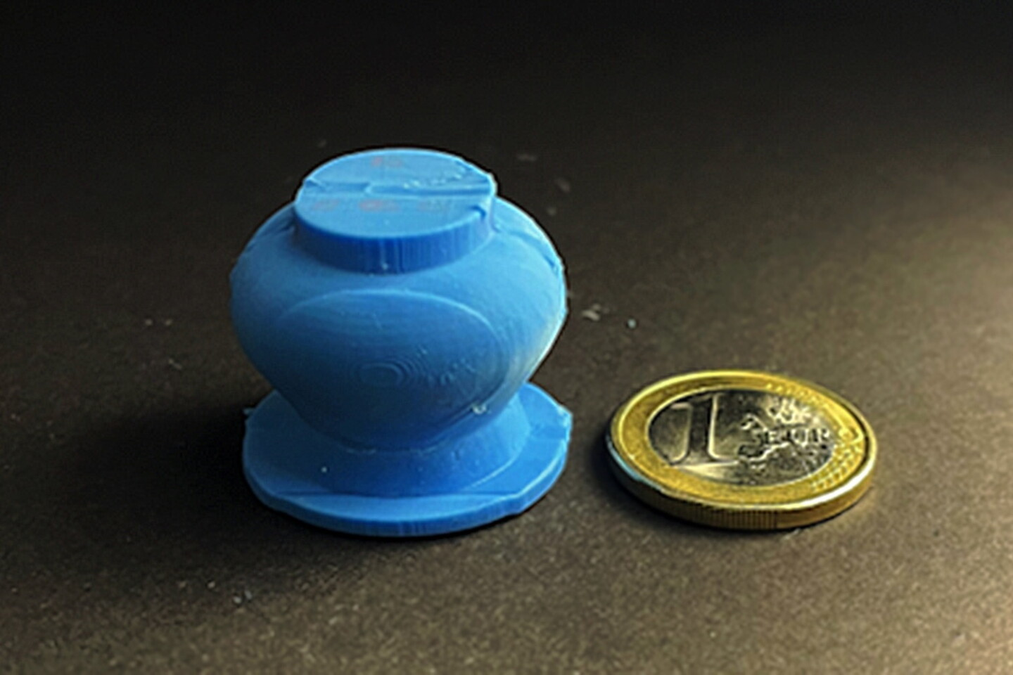The prototype device, with a 1-euro coin for scale