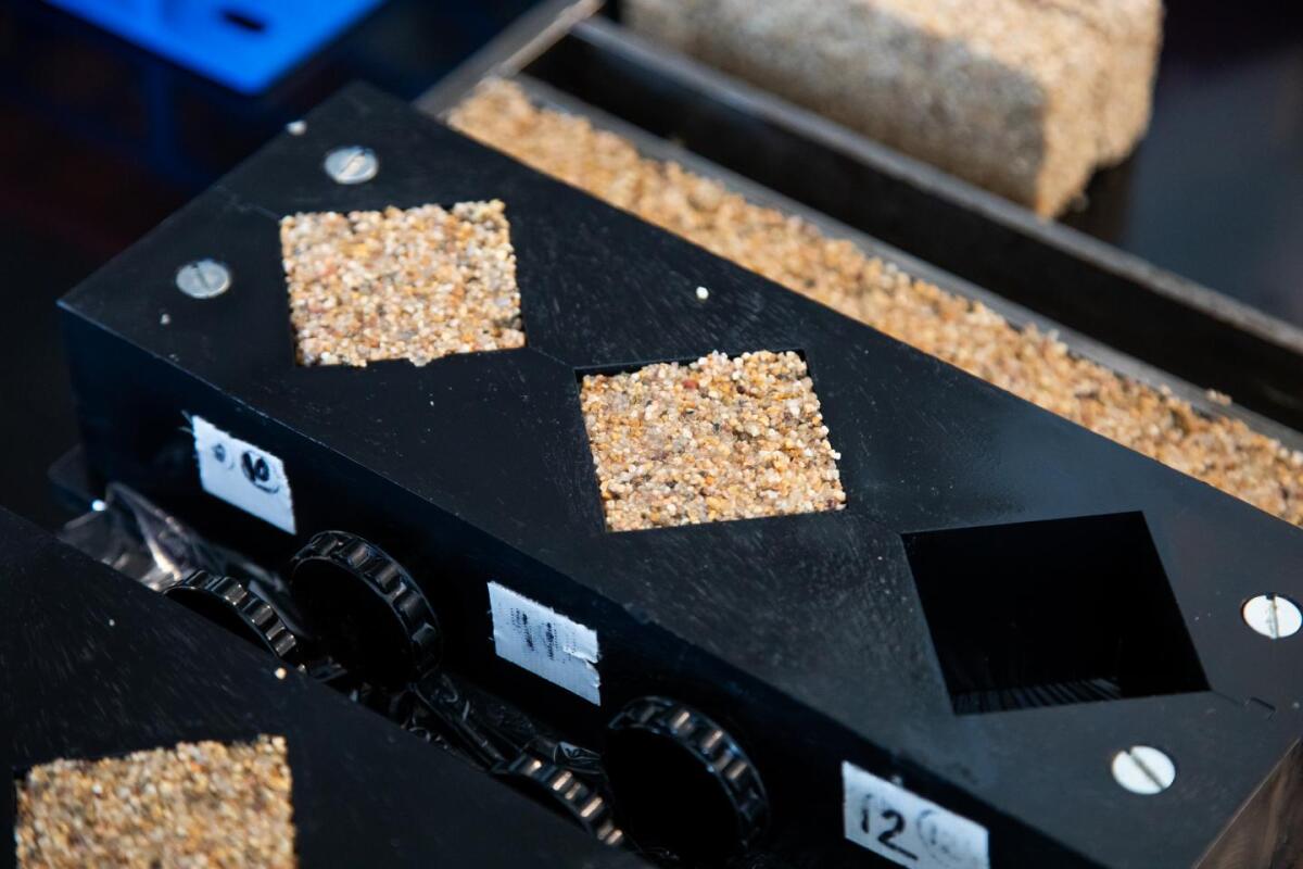 Pieces of the brick, being "grown" in molds