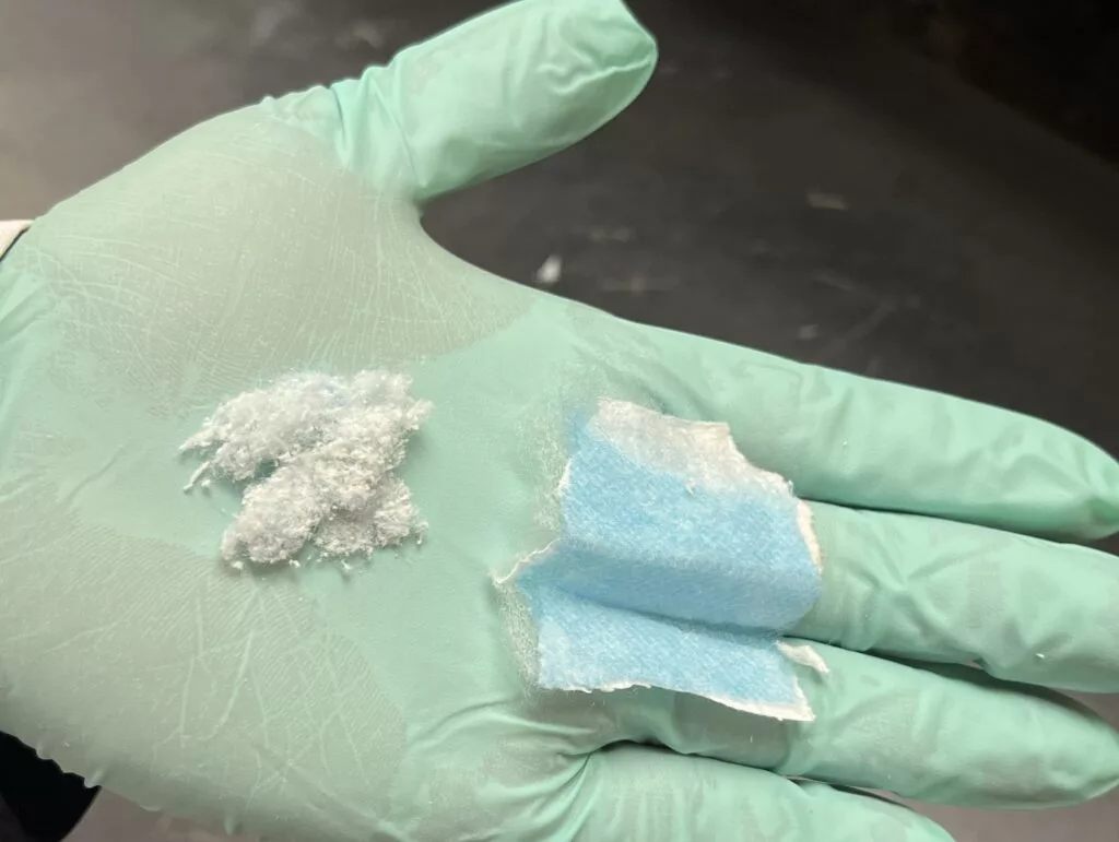 A piece of face mask material (right) along with some of the fibers used in the study