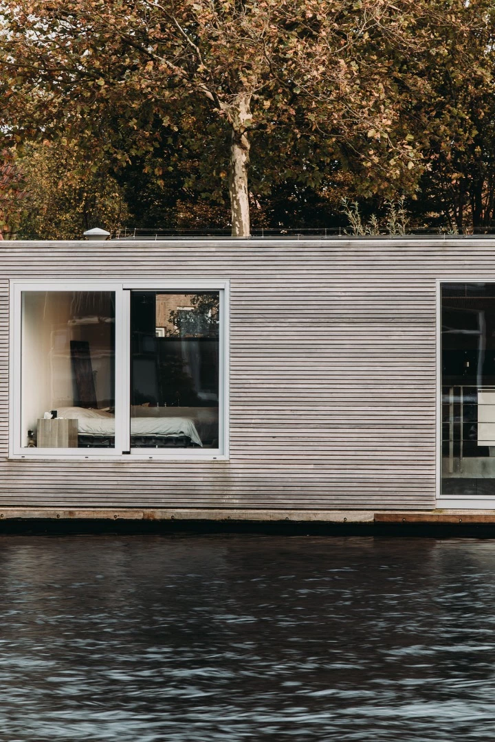 Master bedroom looks out across the river