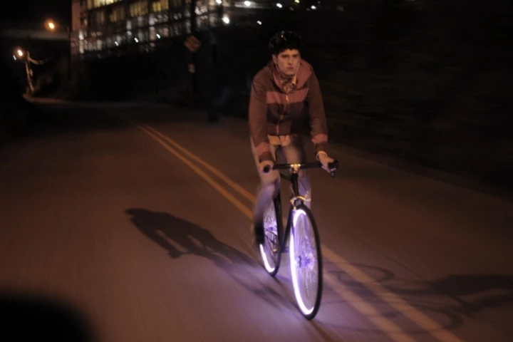 Two groups of entrepreneurs are currently developing separate products (one of which is the Aura system, above), both of which are intended to let bicycle wheels serve as running lights
