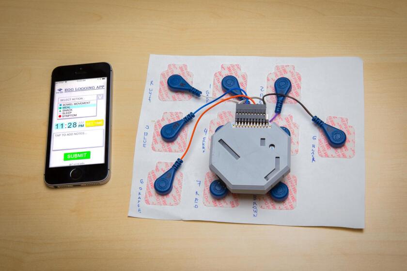 The setup consists of 10 standard electrodes of the type used in electrocardiograms, which are wired to a 3D-printed box containing the electronics and battery
