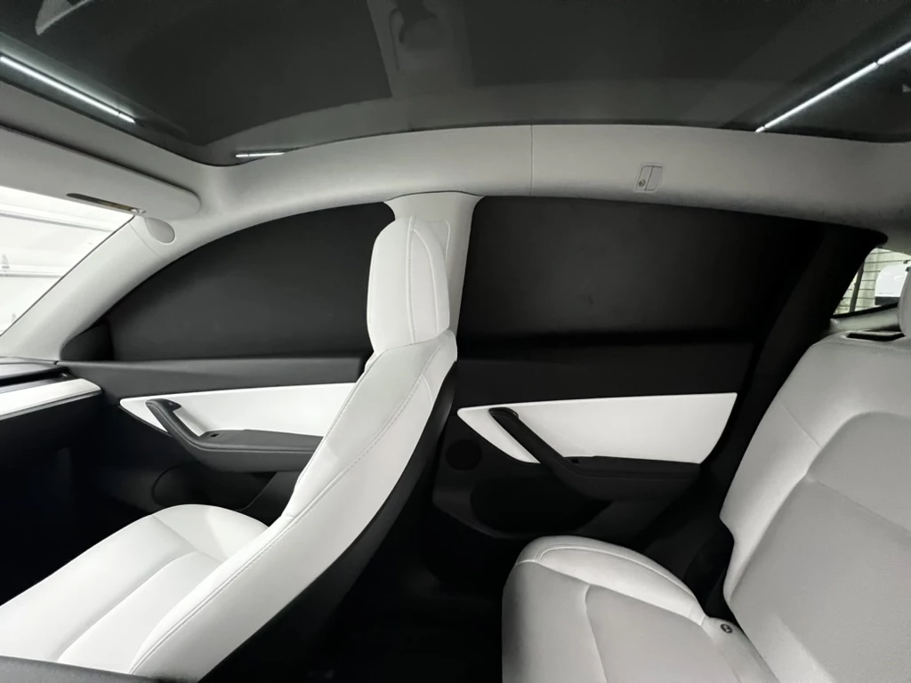 The optional Legit Blackout Window Blinds package consists of nine separate panels which stay in place when the Model Y's doors are opened and closed