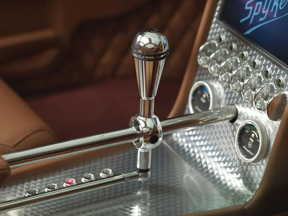 Spyker uses high-end leather, aluminum and aero-styled controls to create a unique look