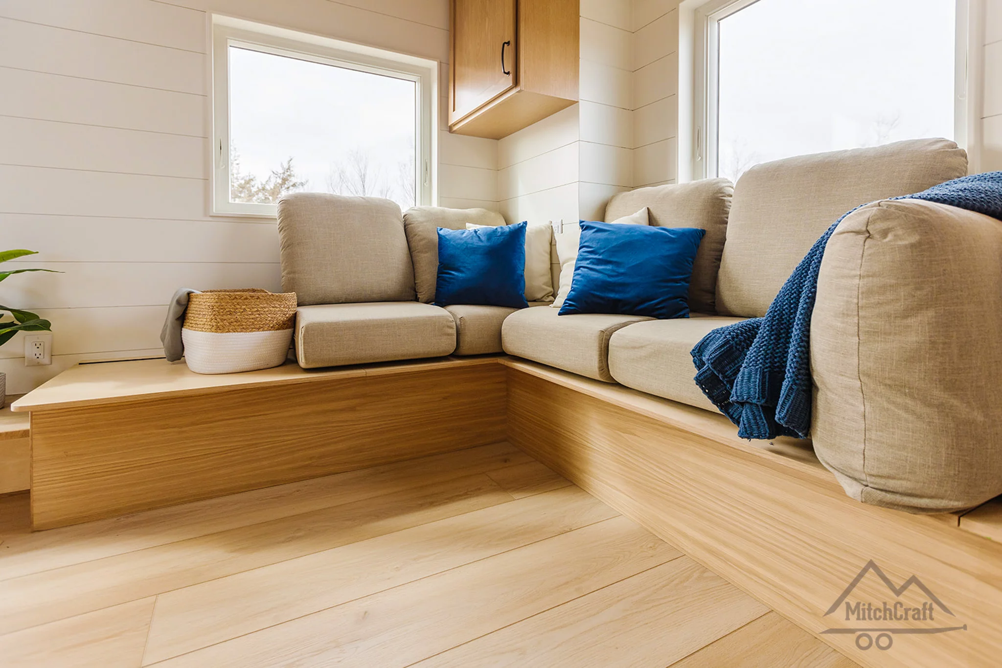 The living room in the CC 31' x 10' features a large L-shaped sofa